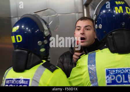 London, UK. 24th Oct, 2015. A bystander shouts at protesters to 'go back to their own country.' Credit:  Louis Mignot/Alamy Live News Stock Photo