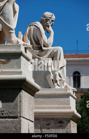 Marble statue of Greek founder of western philosophy, Socrates in front of the facade of Athens academy building. Greece. Stock Photo