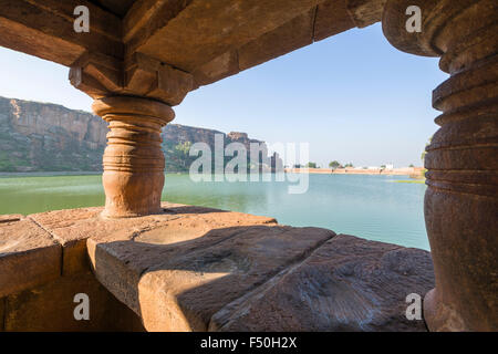 The view from Buthanath Temple across the lake towards the cliff and the caves Stock Photo