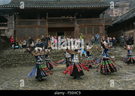 The dancers and the audience with their variety of camera, Lusheng ground, Langde Shang Miao Village, Guizhou Province, China Stock Photo