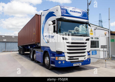 Shipping container lorry on a weigh-bridge Stock Photo