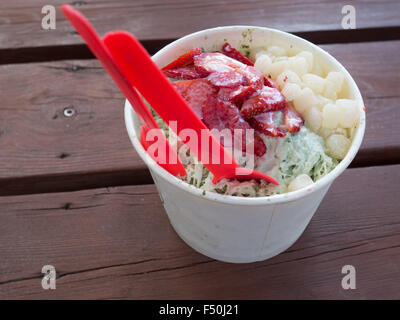 Green tea-flavored  shaved ice with strawberries and mochi Stock Photo