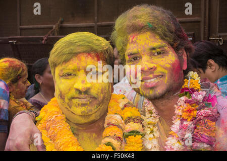 Portraits of two of thousands of devotees, who are celebrating Holi festival extensively by throwing colorpowder and water in th Stock Photo