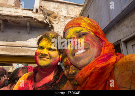 Portraits of two of thousands of devotees, who are celebrating Holi festival extensively by throwing colorpowder and water in th Stock Photo