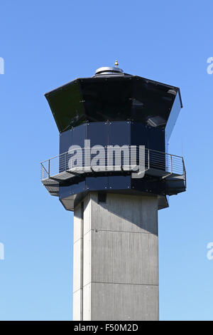 Control tower against a clear blue sky Stock Photo