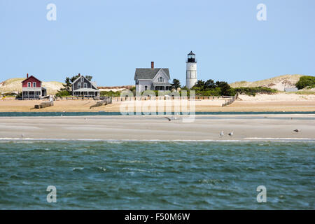 Sandy Neck Beach's old cottage colony and Sandy Neck Lighthouse seen from the water, Cape Cod, Massachusetts Stock Photo