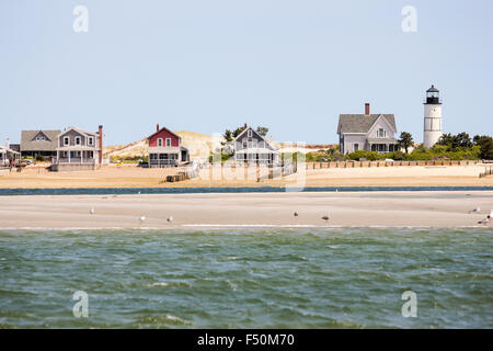 Sandy Neck Beach's old cottage colony and lighthouse seen from the water, Cape Cod, Massachusetts Stock Photo