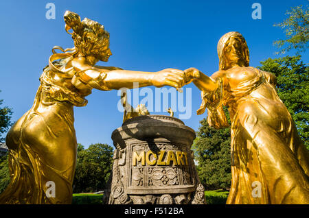 Dancing golden sculptures as an hommage to Mozart Stock Photo