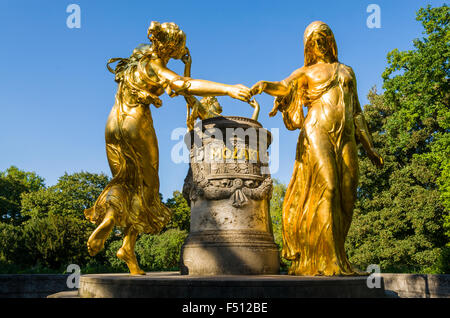 Dancing golden sculptures as an hommage to Mozart Stock Photo