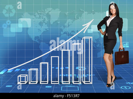 Woman with leather briefcase standing next to bar graph Stock Photo