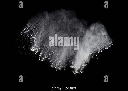 Abstract design of white powder cloud against dark background Stock Photo