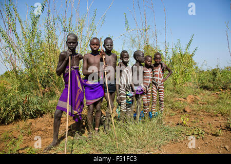 A group of young Mursi boys. Debub Omo Zone, Ethiopia, close to the Sudanese border. Stock Photo