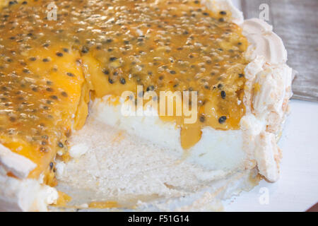 Passion creme cake, with meringue and mango Stock Photo