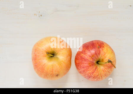 Two organic apples on a white table top view for background Stock Photo