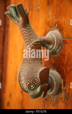 The Brass dolphin is a traditional Maltese door knocker seen all over the island. This is a particularly appealing rendition Stock Photo