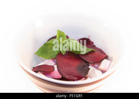 Beetroot and feta salad, with basil, isolated on white background Stock Photo