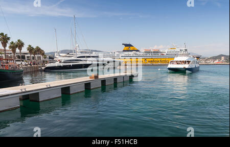 Ajaccio, France - June 29, 2015: Port of Ajaccio, Corsica. Small passenger ferry with tourists on board arriving Stock Photo