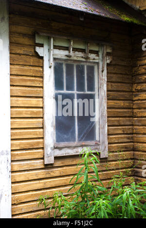 Plastic window, on a yellow, old house Stock Photo