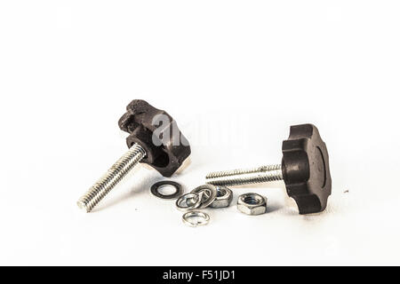 Closeup on isolated bolts and nuts, on white background Stock Photo