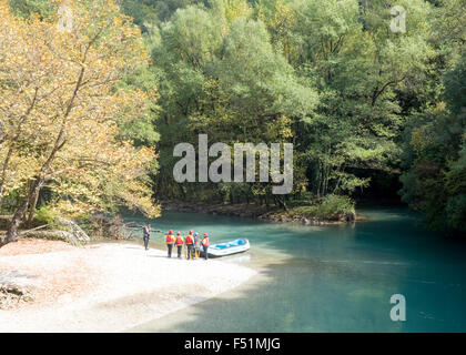 Rafting in Voidomatis river, close to Kleidonia stone bridge, Zagori, Pindus mountains, Epirus, Greece. Stock Photo