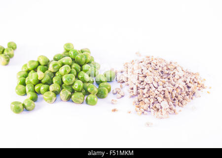 Piles of fresh and dried peas, isolated on white background Stock Photo