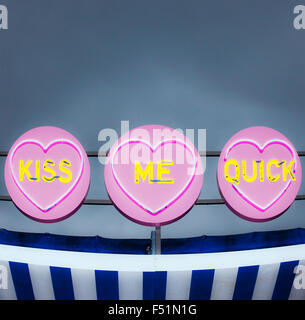 Kiss Me Quick neon sign. Stock Photo