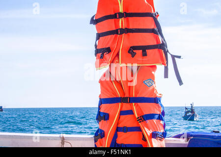 Lifejackets on a pole,on the sea, outside Phu Quoc, Vietnam Stock Photo