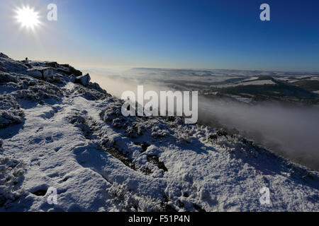 January, winter snow and mist over Curbar valley; Derbyshire County; Peak District National Park; England; UK Stock Photo