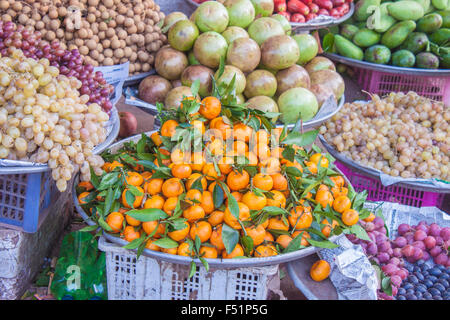 A pile of orange mandarins, Citrus unshiu, at a market, in phu quoc, Vietnam Stock Photo