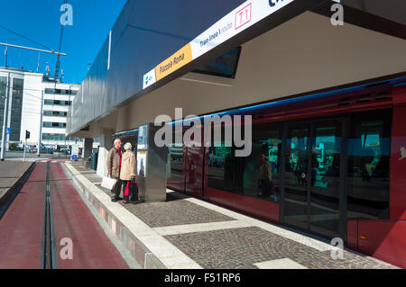 Elderly senior couple consult timetable for Actv tram in piazzale Roma, Venice, Italy Stock Photo