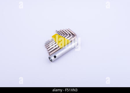 allen keys in yellow clamp on white background Stock Photo