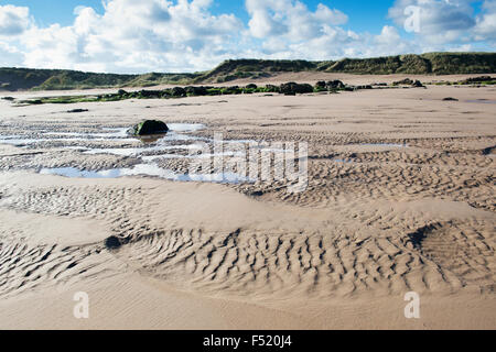Rippled sand and sea water on a beach at low tide. Scremerston, Berwick Upon Tweed, Northumberland, England. Stock Photo