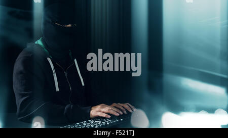 Computer programmer typing on keyboard, hacker futuristic cybercrime Stock Photo