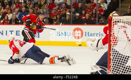 Chicago, Illinois, USA. 22nd Oct, 2015. - Blackhawk #19 Jonathan Toews attempts a shot on Panther Goaltender #1 Roberto Luongo during the National Hockey League game between the Chicago Blackhawks and the Florida Panthers at the United Center in Chicago, IL Mike Wulf/CSM/Alamy Live News Stock Photo