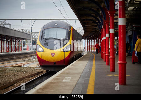 Stockport railway station, a Pendolino run by Virgin on route to London Euston   Travel Travellers Traveling tourist tourism des Stock Photo