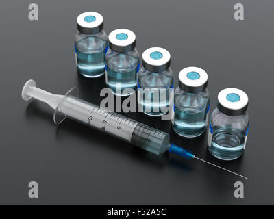 Syringe and vials on black background Stock Photo