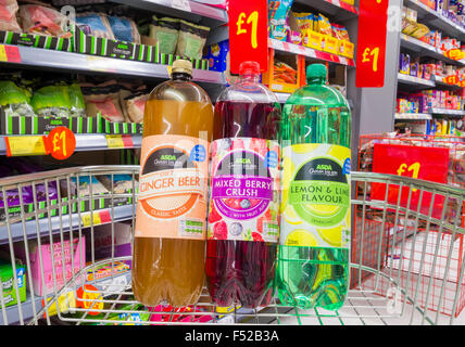 Asda fizzy juice drinks in shopping trolley in Asda supermarket store. UK Stock Photo