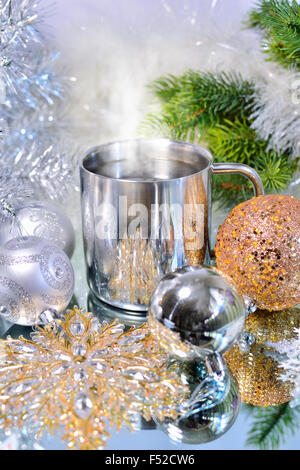 Christmas decoration with balls, tree and a cup of hot coffee Stock Photo