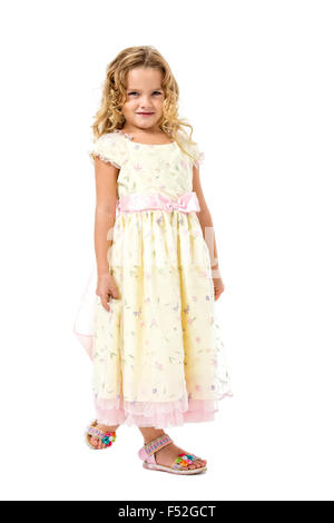 Little Girl in a Light Dress Posing, on white background Stock Photo