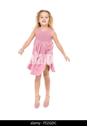 Little Girl in a Pink Dress Jumping, on white background Stock Photo