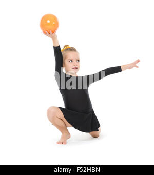 Little Gymnast Practicing with a Ball, on white background Stock Photo