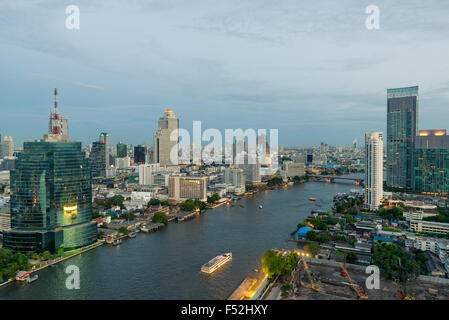 Beautiful skyline along Chao Phraya River in Bangkok at dusk , Thailand Stock Photo