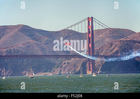 Lucas Oil pitts plane performing flight demonstration by the Golden Gate Bridge, San Francisco, California, USA Stock Photo