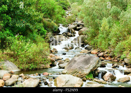 Volcanic Rocks In A Small River Close To Tungurahua Volcano In Ecuador Stock Photo