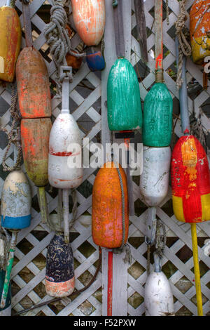 Colorful fishing floats hanging on wall Stock Photo
