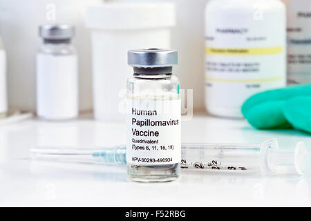 Human Papilloma Virus vaccine with syringe in vial at a clinic. Stock Photo