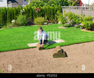 turf, lay, garden, woman, lawn, roll out, Stock Photo