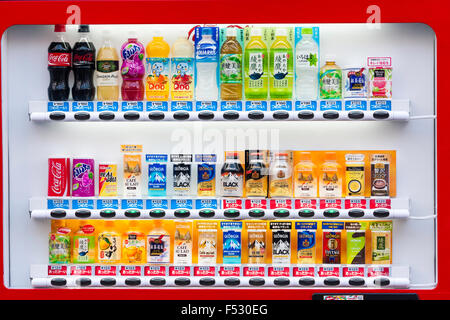 Japanese soft drinks vending maschine serving hot and cold canned drinks including coca-cola, coffees and teas, button colour coded, red equals hot. Stock Photo