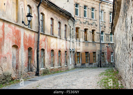 Weathered old town street in abandoned part of Vilnius, Lithuania Stock Photo
