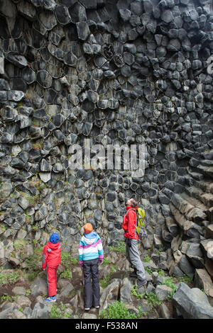 Family studying basalt rock formations at Hljodaklettar, Jokulsargljufur, Nordhurland Eystra, Iceland. Stock Photo